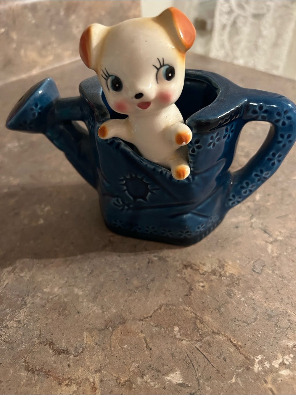Vintage ceramic dog in watering can